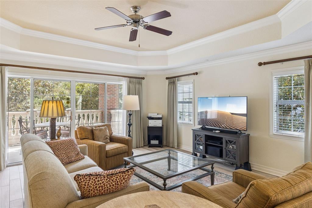 7650 Whisper Way, Unit 204 Reunion, FL 34747 - Photo 6 of 29 a living room with furniture and a window