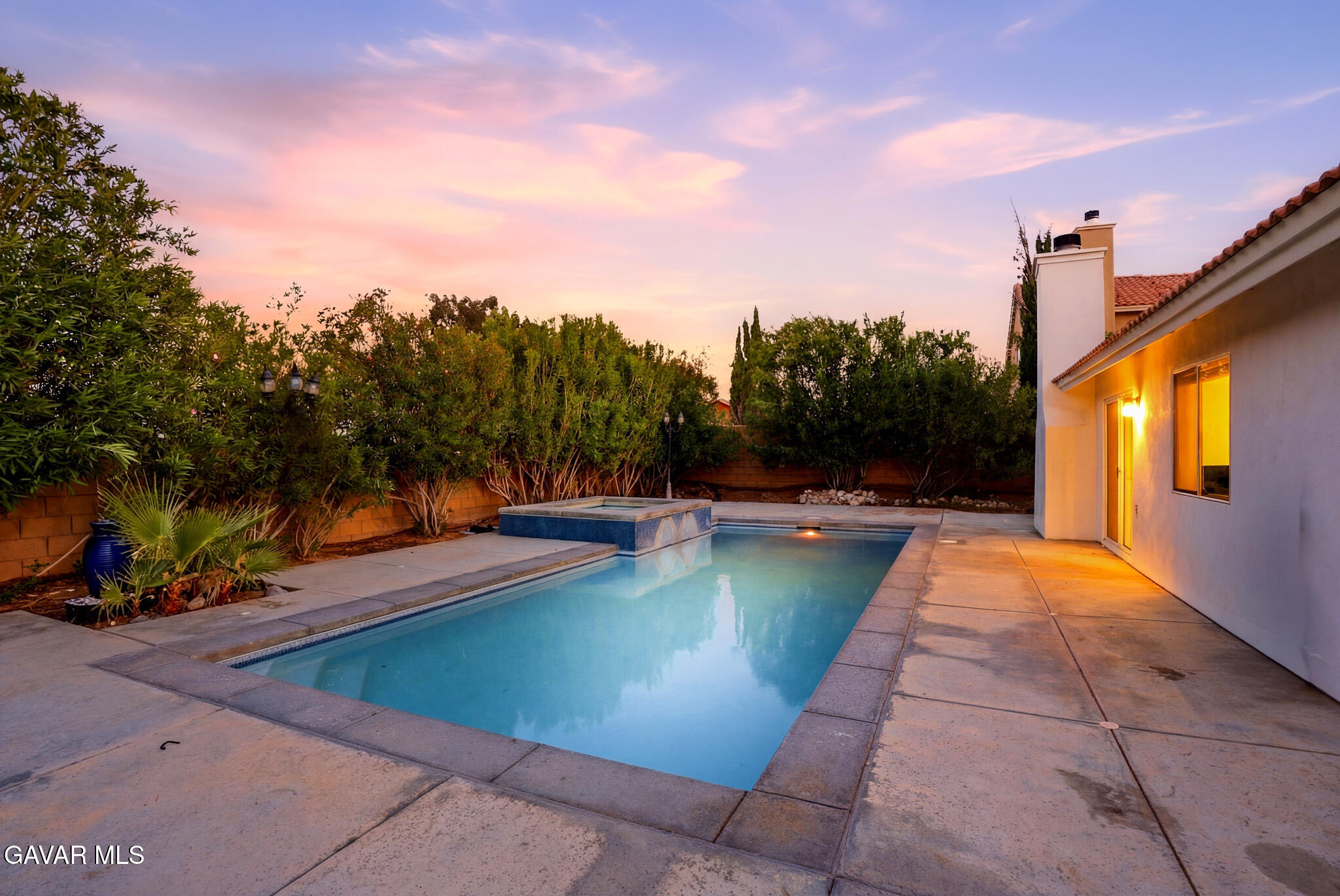36906 Cobalt Street Palmdale, CA 93552 - Photo 24 of 29 a view of swimming pool with seating area and trees around