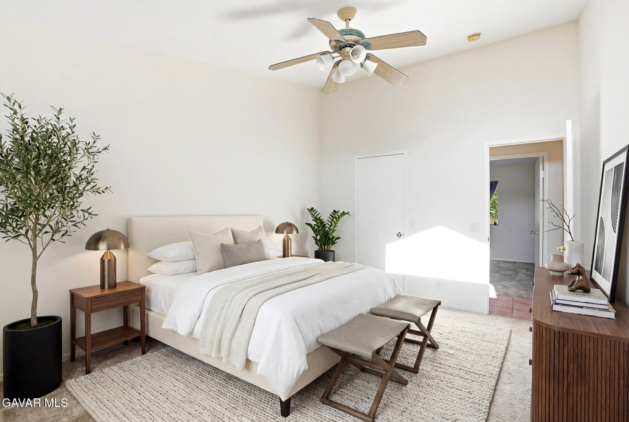 36906 Cobalt Street Palmdale, CA 93552 - Photo 3 of 29 a bedroom with a bed a potted plant on dresser and a chandelier