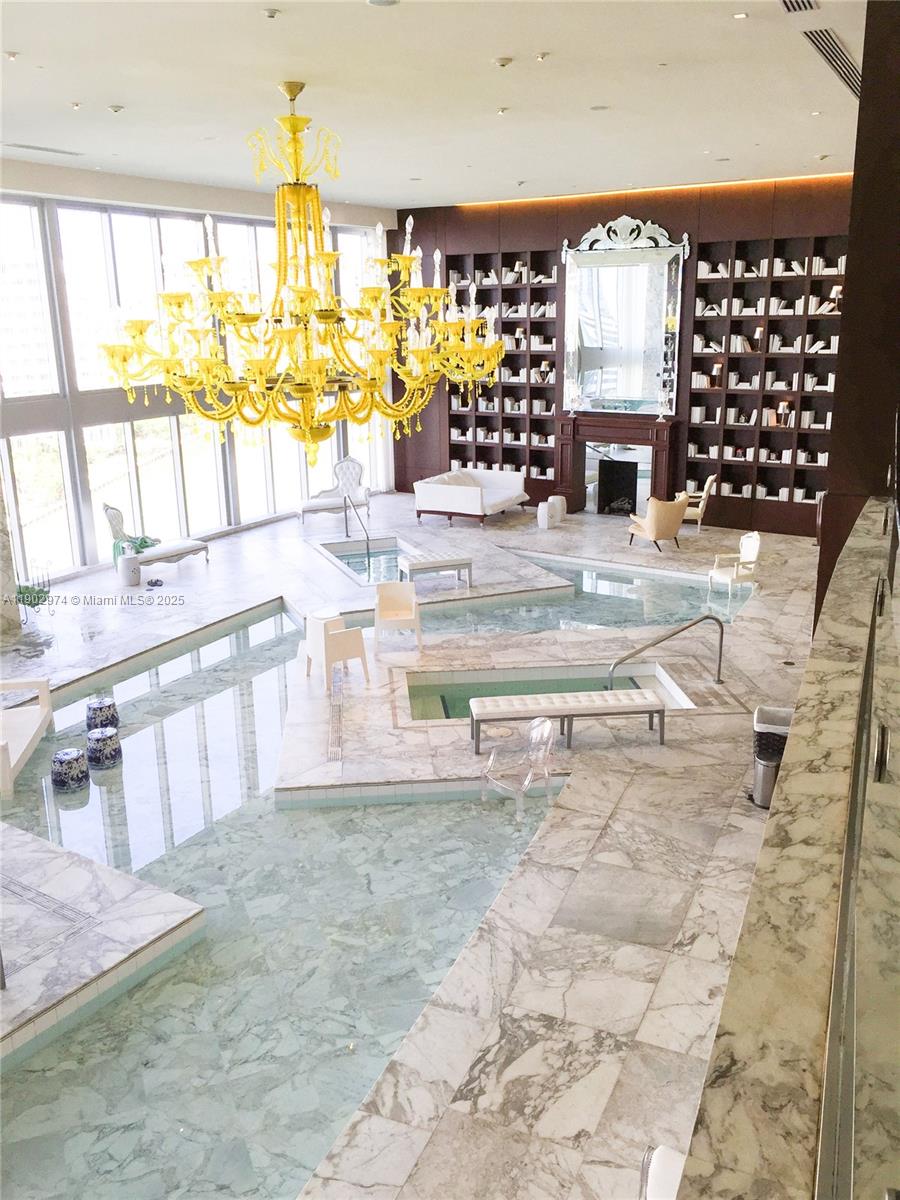 Icon Brickell Miami, FL 33131 - Photo 12 of 13 a living room with fireplace