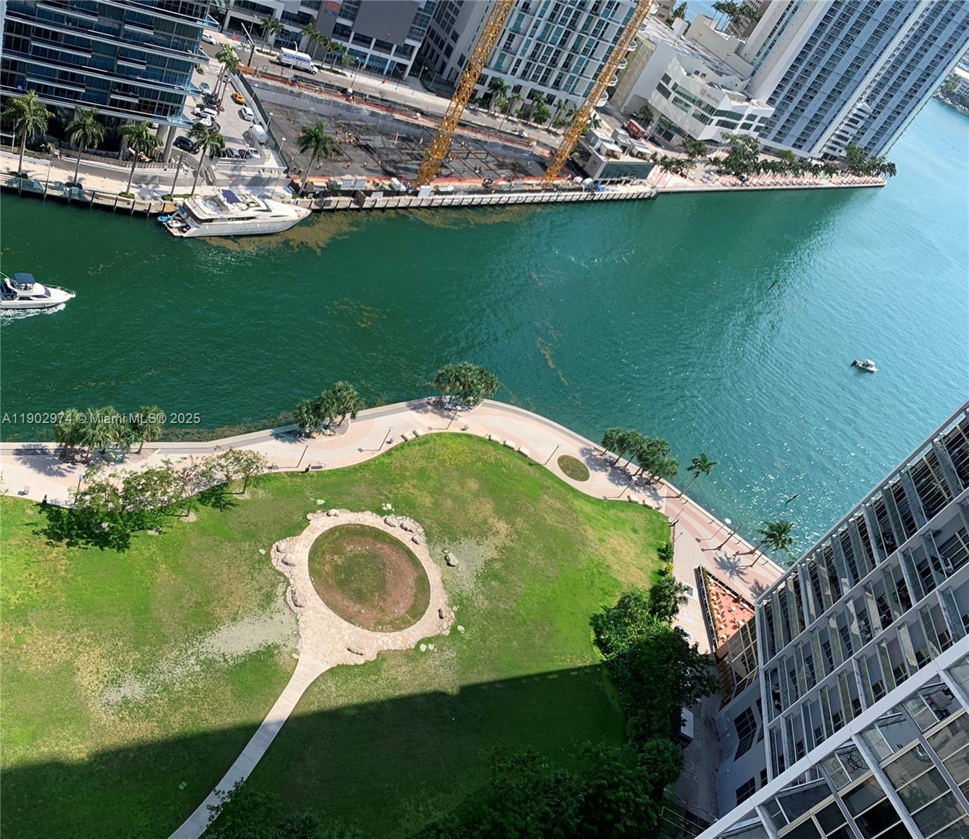 Icon Brickell Miami, FL 33131 - Photo 10 of 13 a view of a swimming pool with a yard