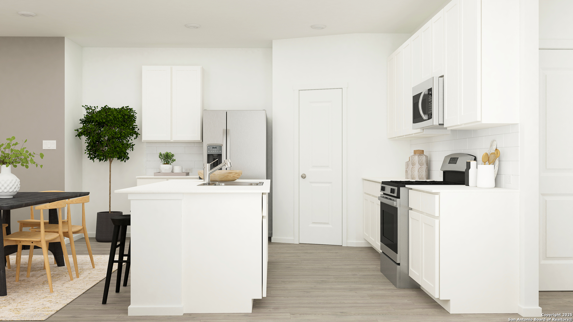 156 Rawhide Ridge Pleasanton, TX 78064 - Photo 3 of 26 a kitchen with a sink a stove and a refrigerator