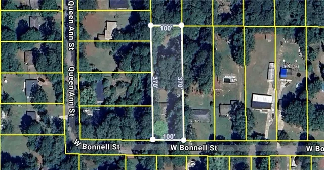 a view of a fireplace with a hallway