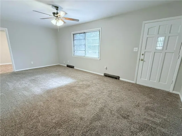 a view of an empty room with a window