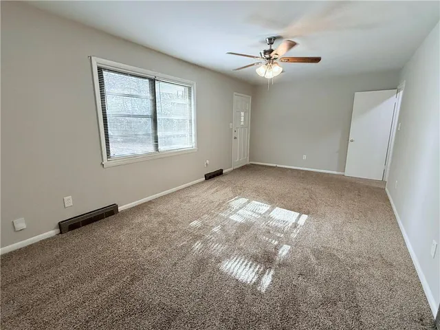 a kitchen with granite countertop a stove top oven sink and cabinets