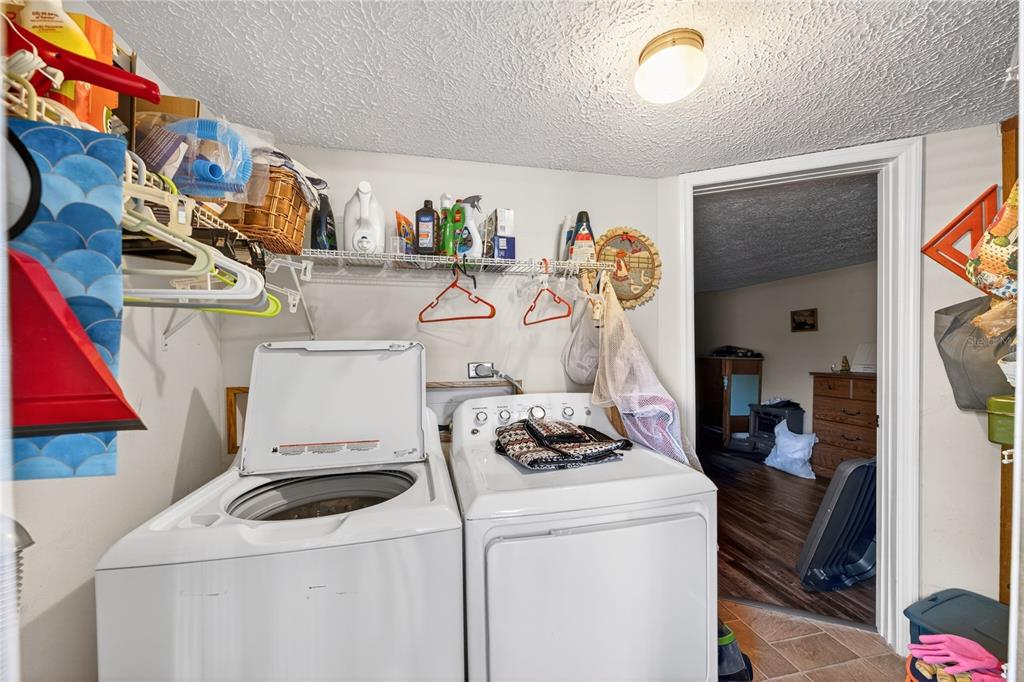 15321 Northeast 160th Avenue Road Salt Springs, FL 32134 - Photo 7 of 22 a view of storage and utility room with washer and dryer