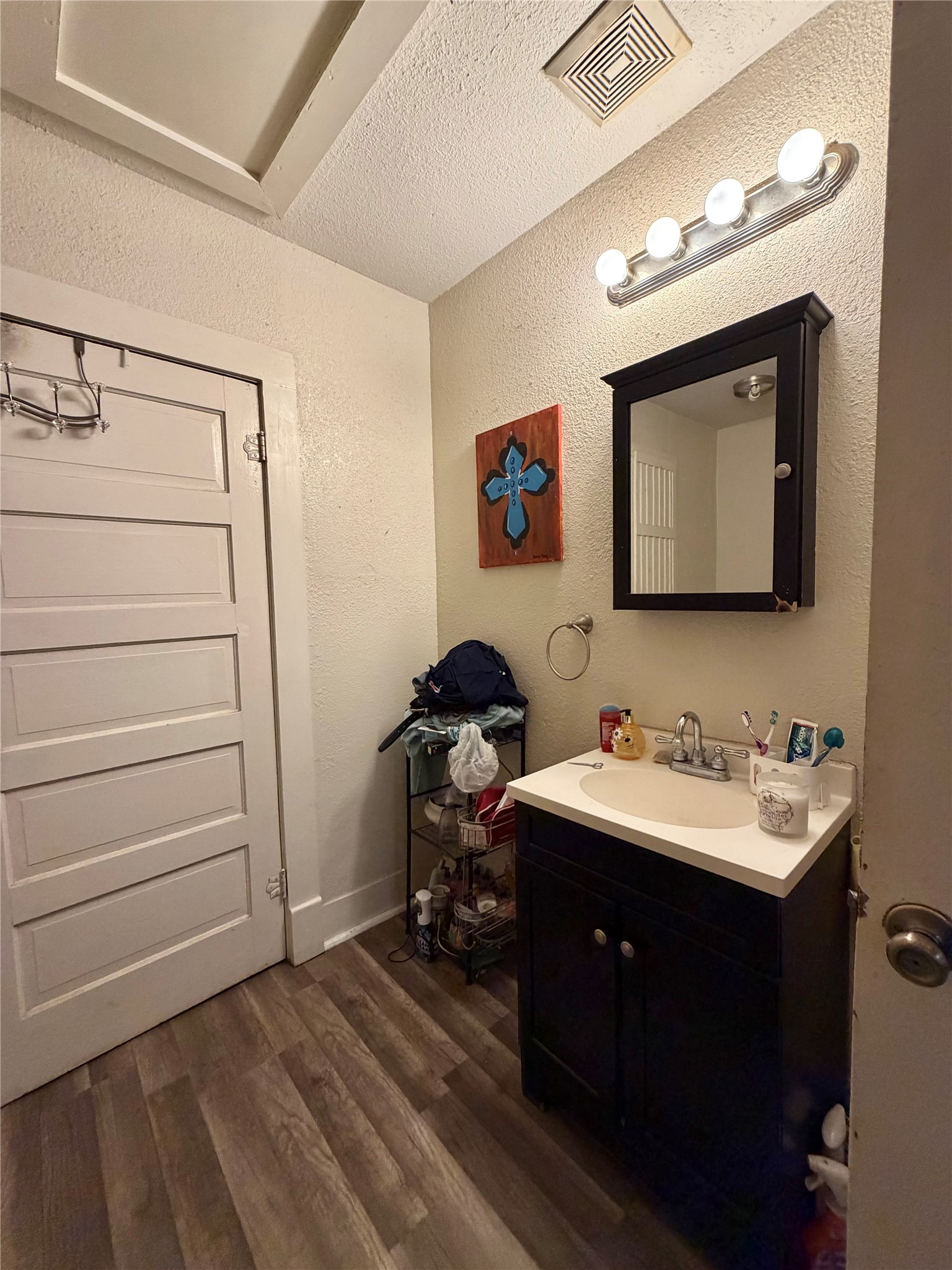 326 West 2nd Street Freeport, TX 77541 - Photo 16 of 24 a bathroom with a sink and a mirror