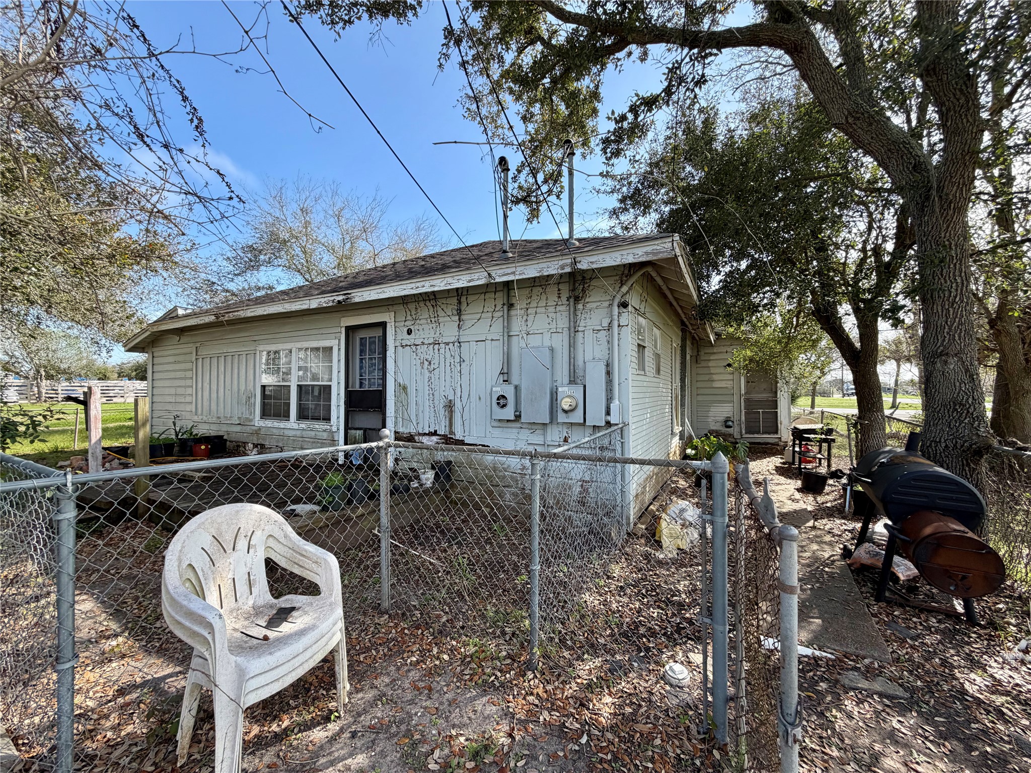 326 West 2nd Street Freeport, TX 77541 - Photo 20 of 24 a backyard of a house with table and chairs