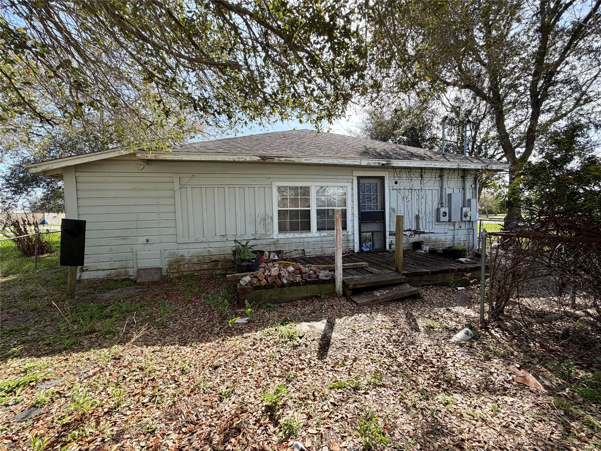 326 West 2nd Street Freeport, TX 77541 - Photo 21 of 24 a view of a house with backyard and chairs
