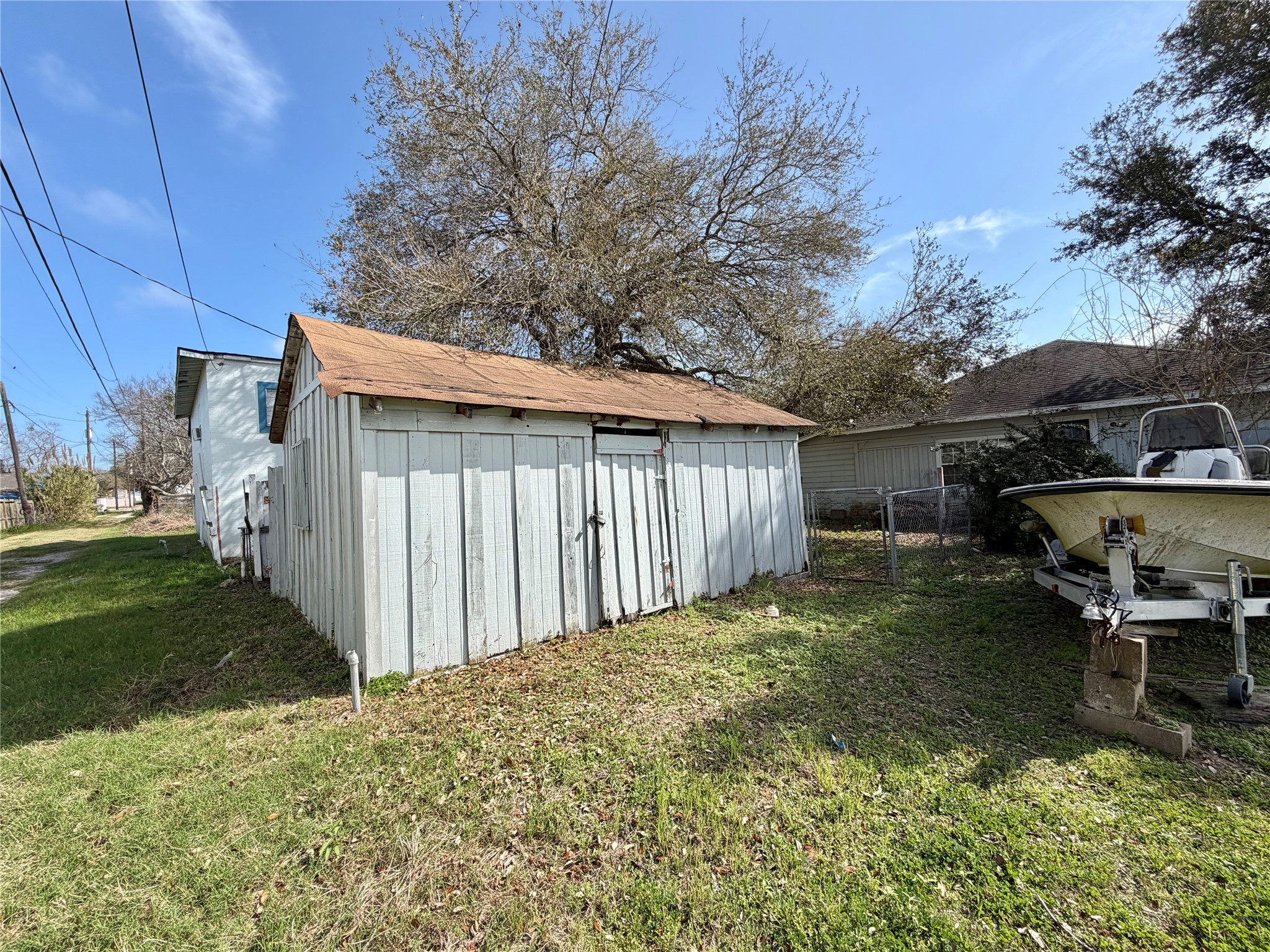 326 West 2nd Street Freeport, TX 77541 - Photo 23 of 24 a backyard of a house with table and chairs
