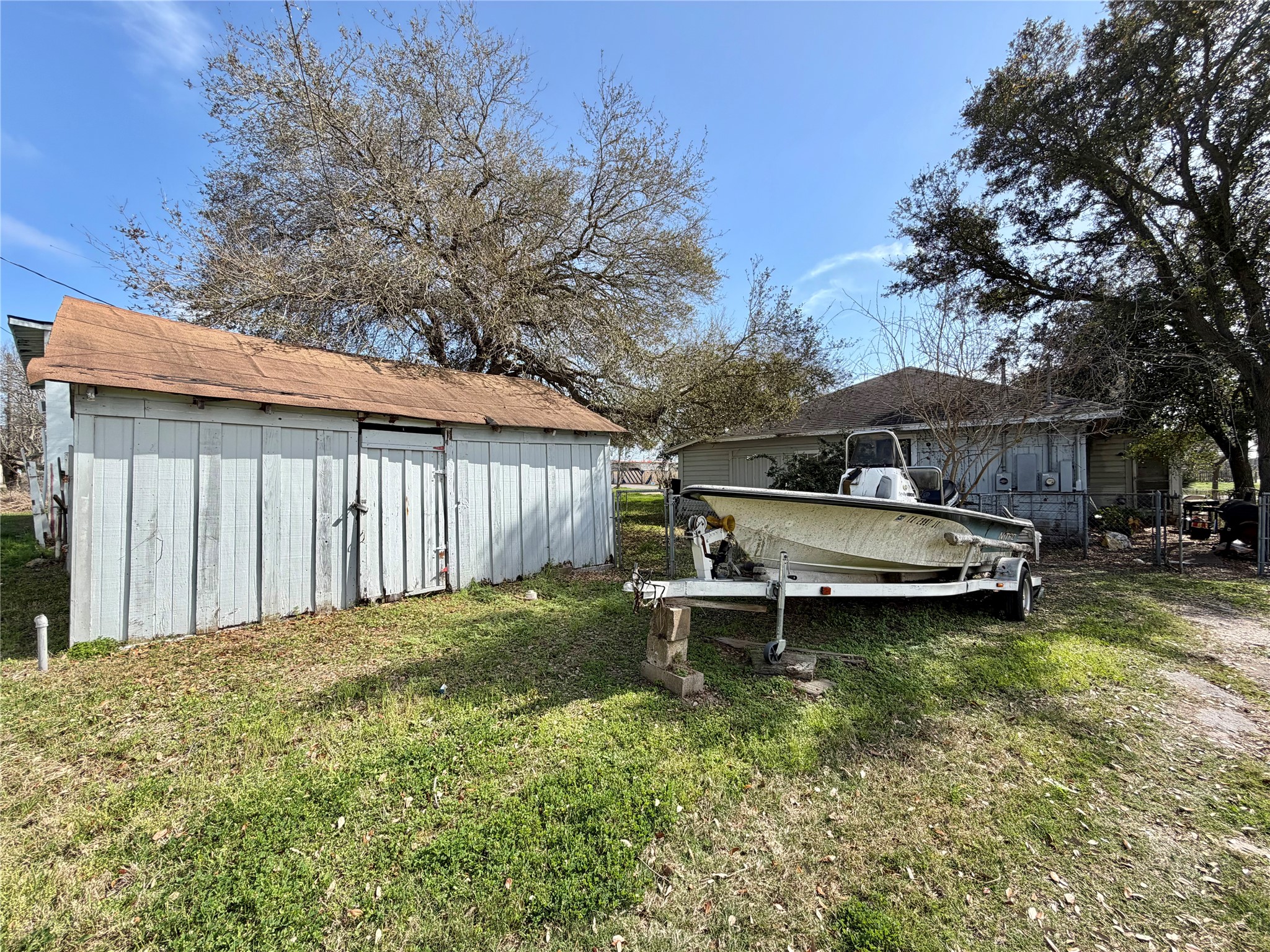 326 West 2nd Street Freeport, TX 77541 - Photo 24 of 24 a view of a house with pool and wooden fence