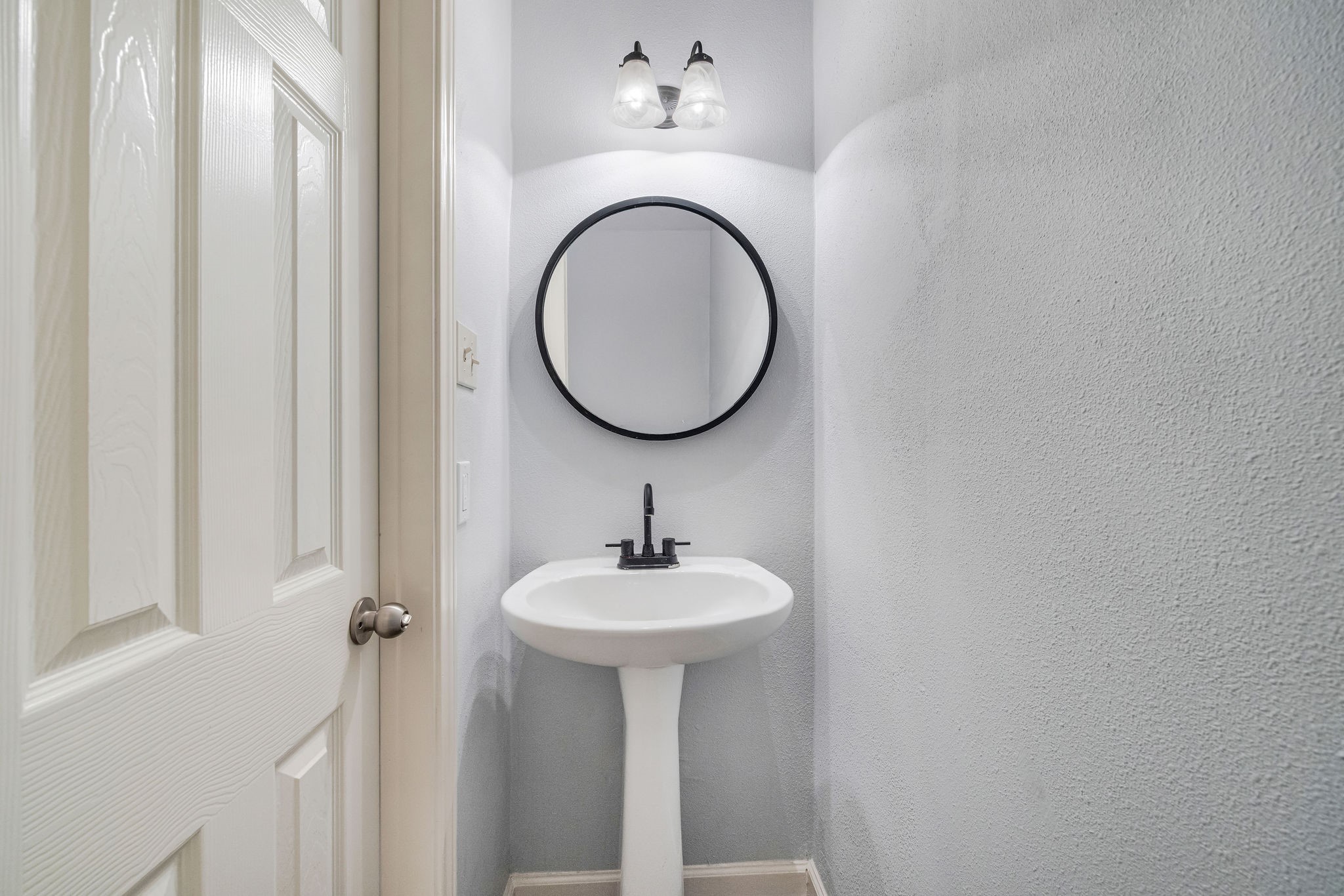 8018 Grow Lane Houston, TX 77040 - Photo 10 of 20 Half bath downstairs perfect for guests.