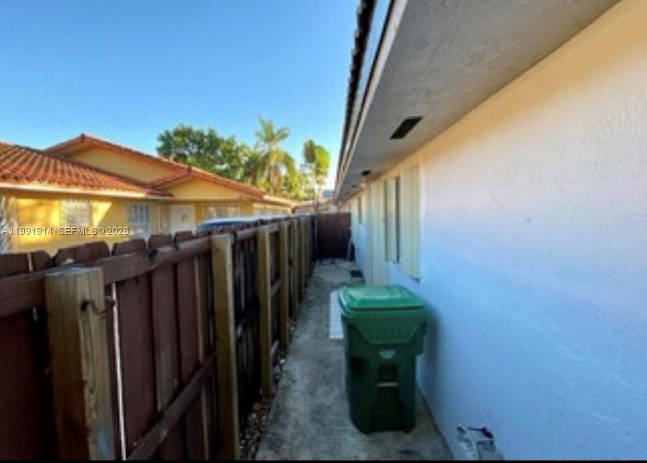 5580 Northwest 3rd Street, Unit 5580 Miami, FL 33126 - Photo 2 of 10 a view of a backyard with wooden fence