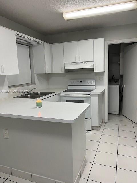 5580 Northwest 3rd Street, Unit 5580 Miami, FL 33126 - Photo 4 of 10 a kitchen with a stove a sink and a refrigerator