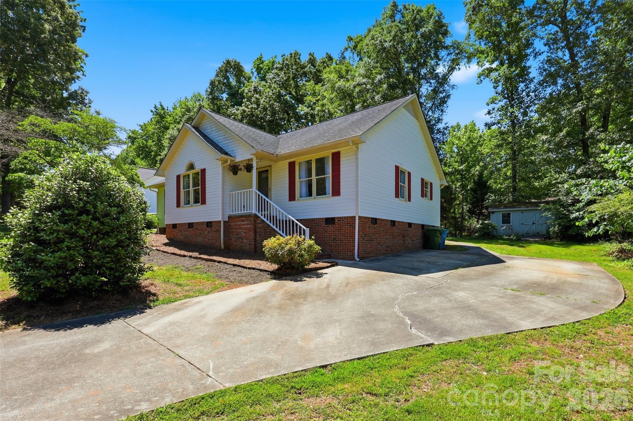 913 Pleasant Ridge Road Fort Mill, SC 29715 - Photo 22 of 40 a front view of house with yard and trees around