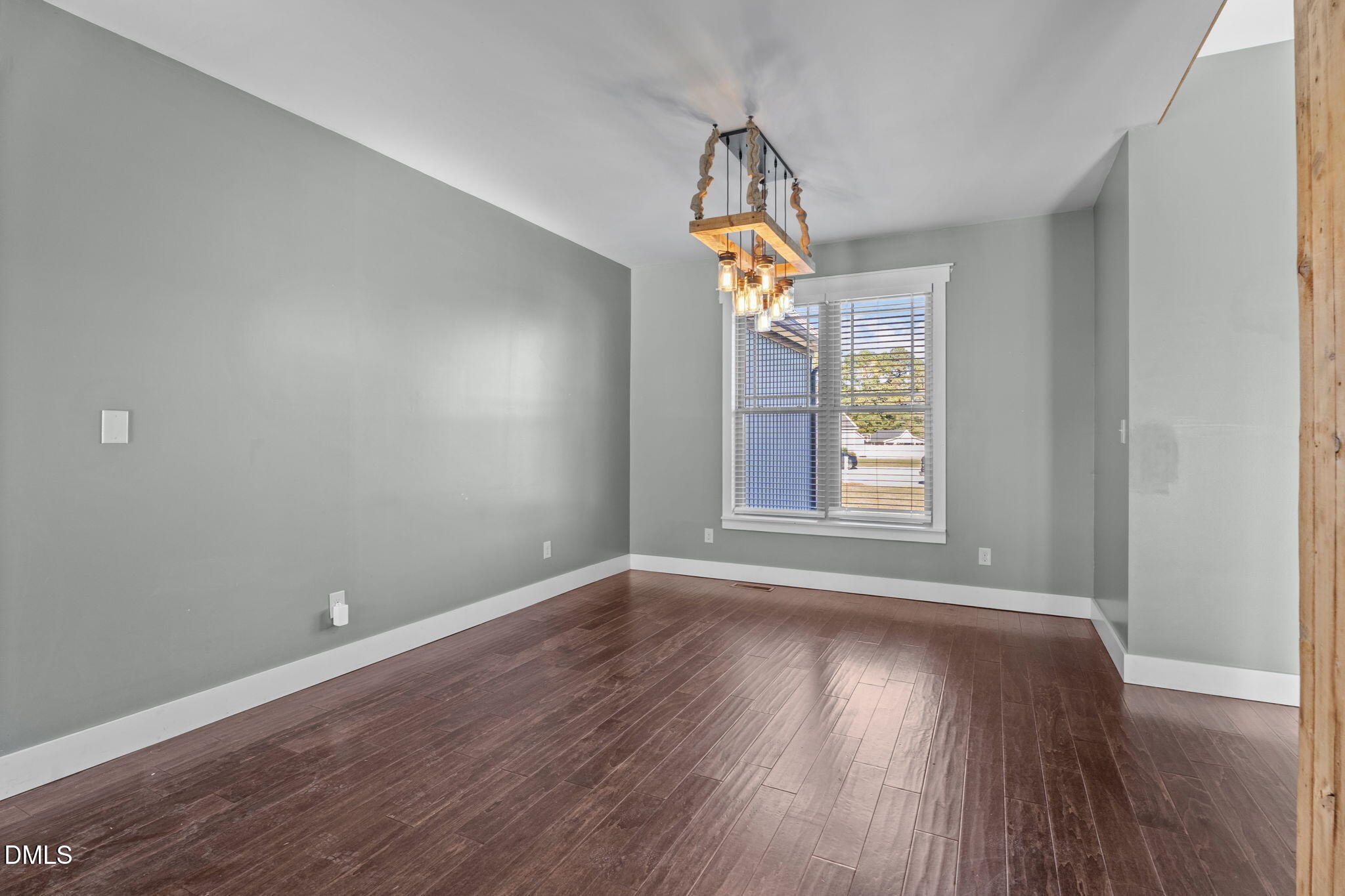 6559 Dolphus Lane Sims, NC 27880 - Photo 11 of 43 a view of livingroom with window and wooden floor