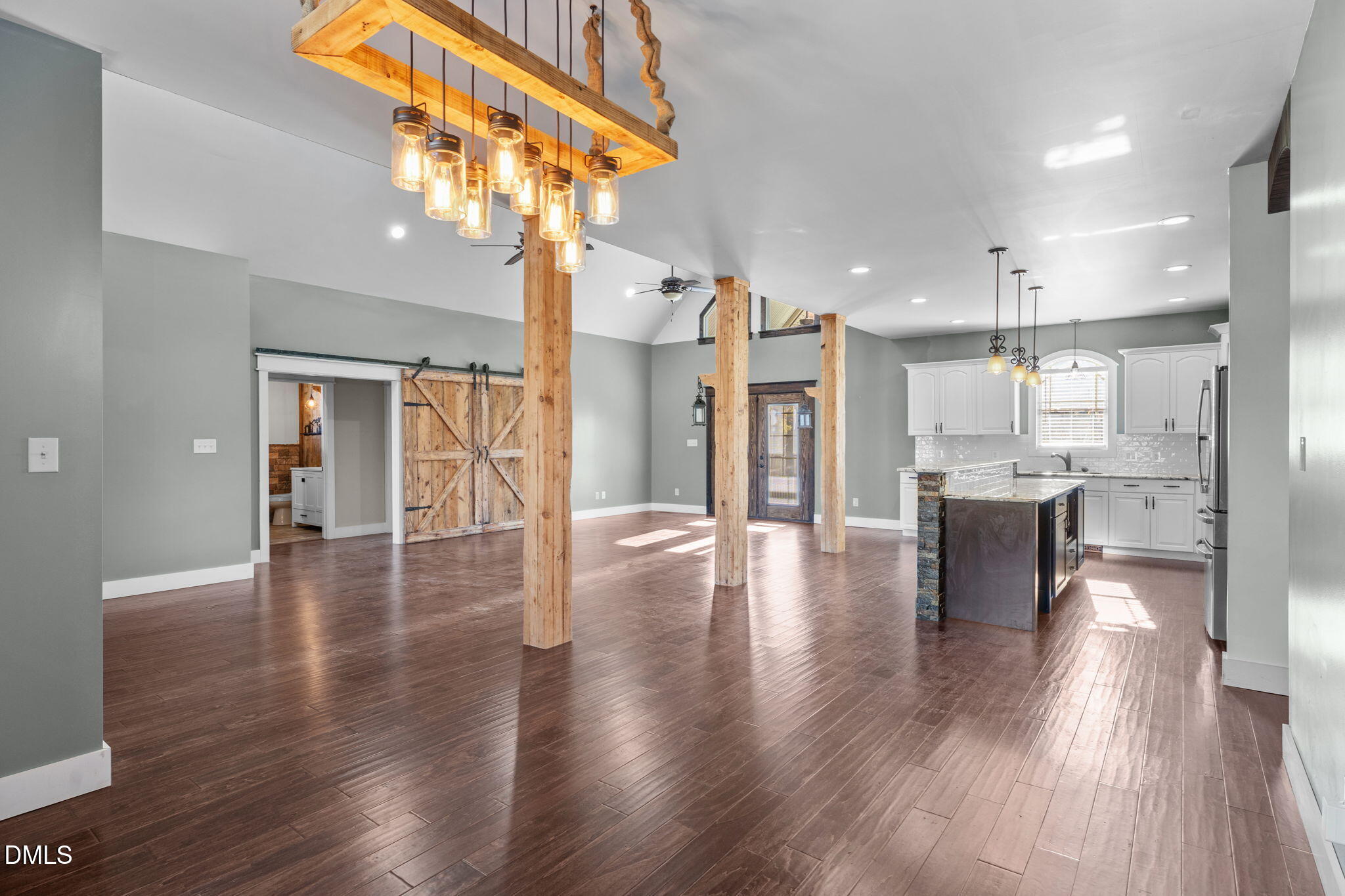 6559 Dolphus Lane Sims, NC 27880 - Photo 12 of 43 a view of a living room and kitchen with a chandelier
