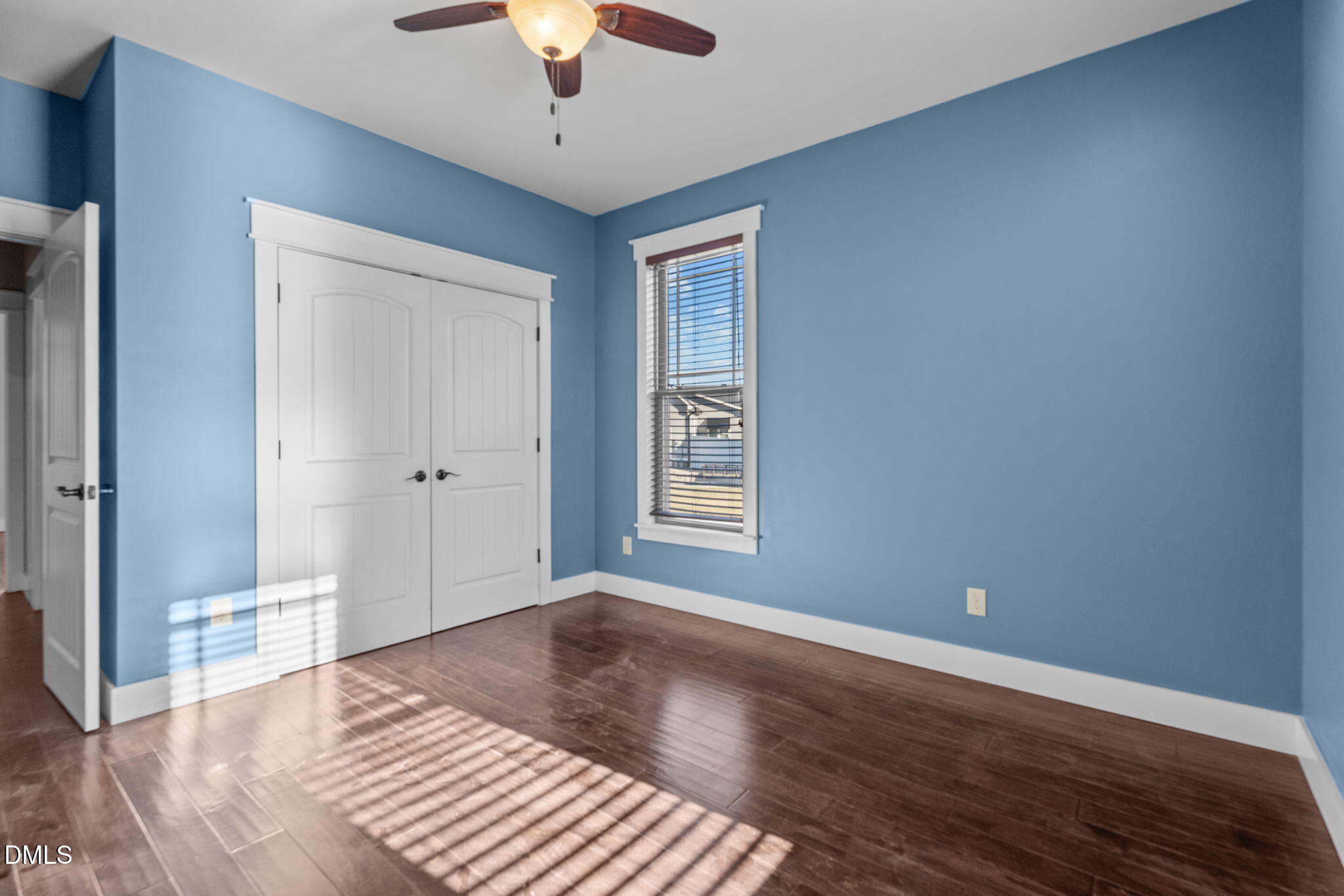 6559 Dolphus Lane Sims, NC 27880 - Photo 21 of 43 a view of an empty room with wooden floor and a window