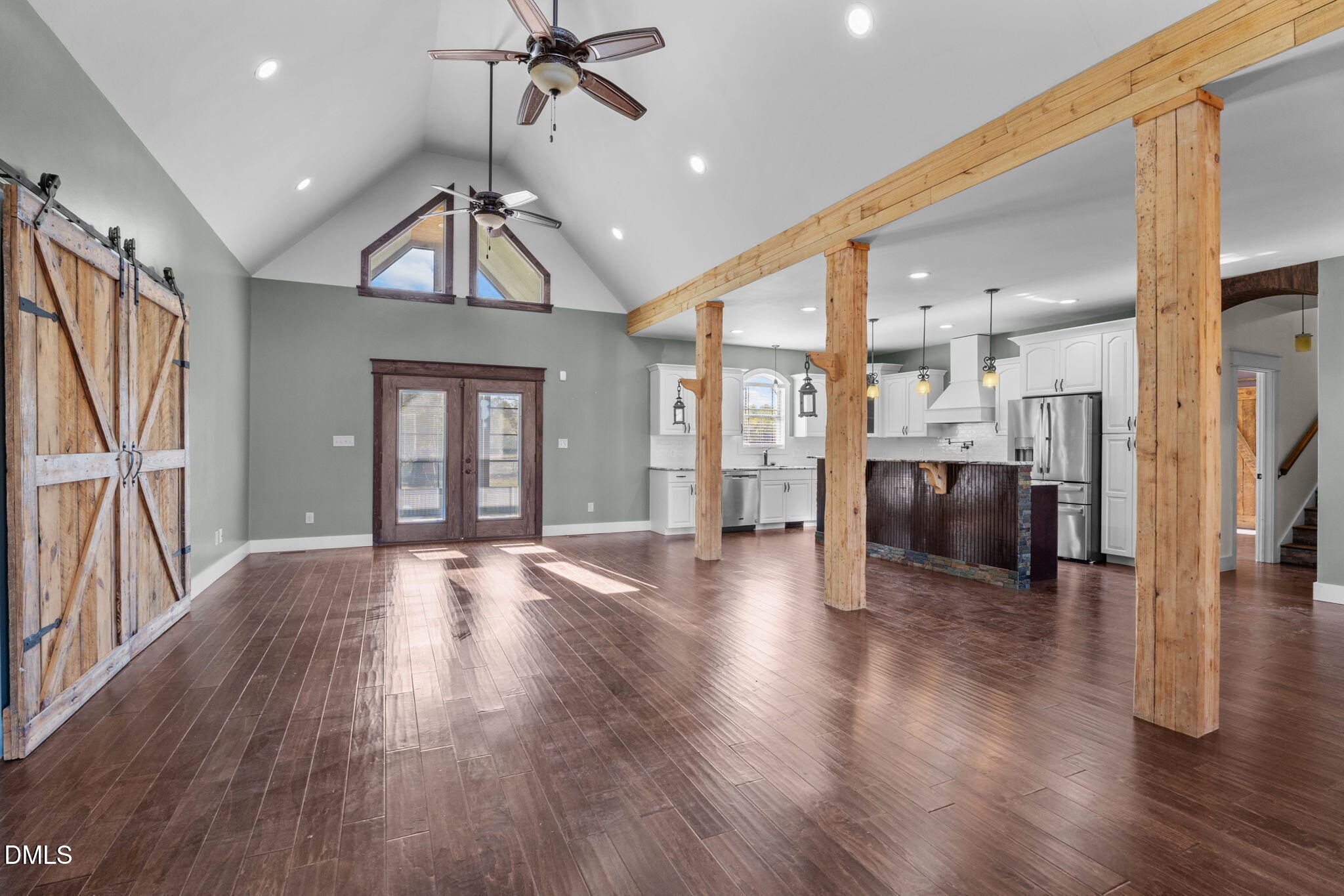 6559 Dolphus Lane Sims, NC 27880 - Photo 4 of 43 a view of a hallway with wooden floor windows and a chandelier