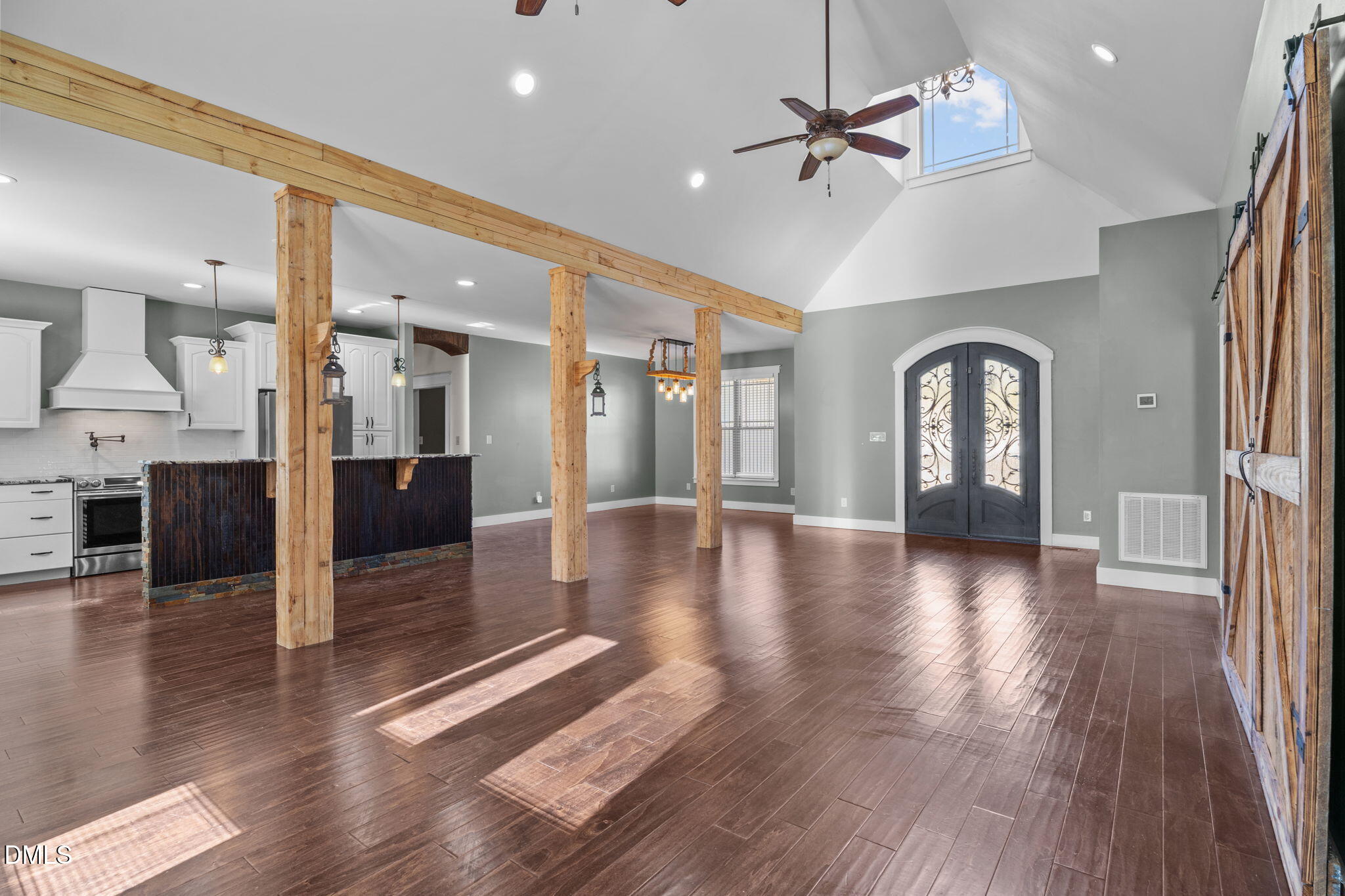 6559 Dolphus Lane Sims, NC 27880 - Photo 5 of 43 a view of a hallway with wooden floor and a kitchen