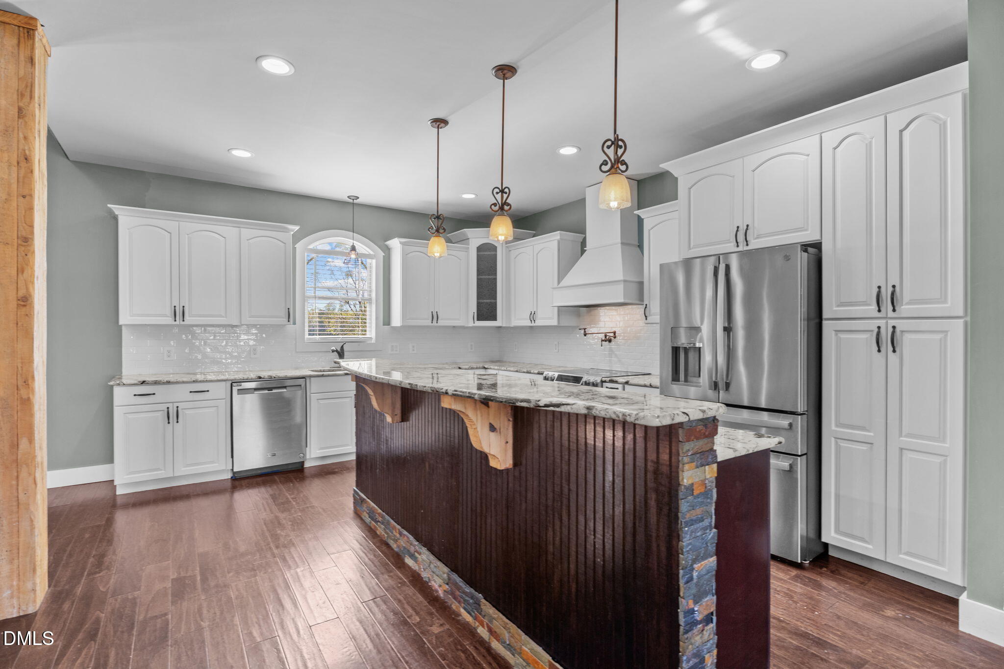 6559 Dolphus Lane Sims, NC 27880 - Photo 7 of 43 a kitchen with stainless steel appliances granite countertop a refrigerator a sink dishwasher a oven and a dining table with wooden floor