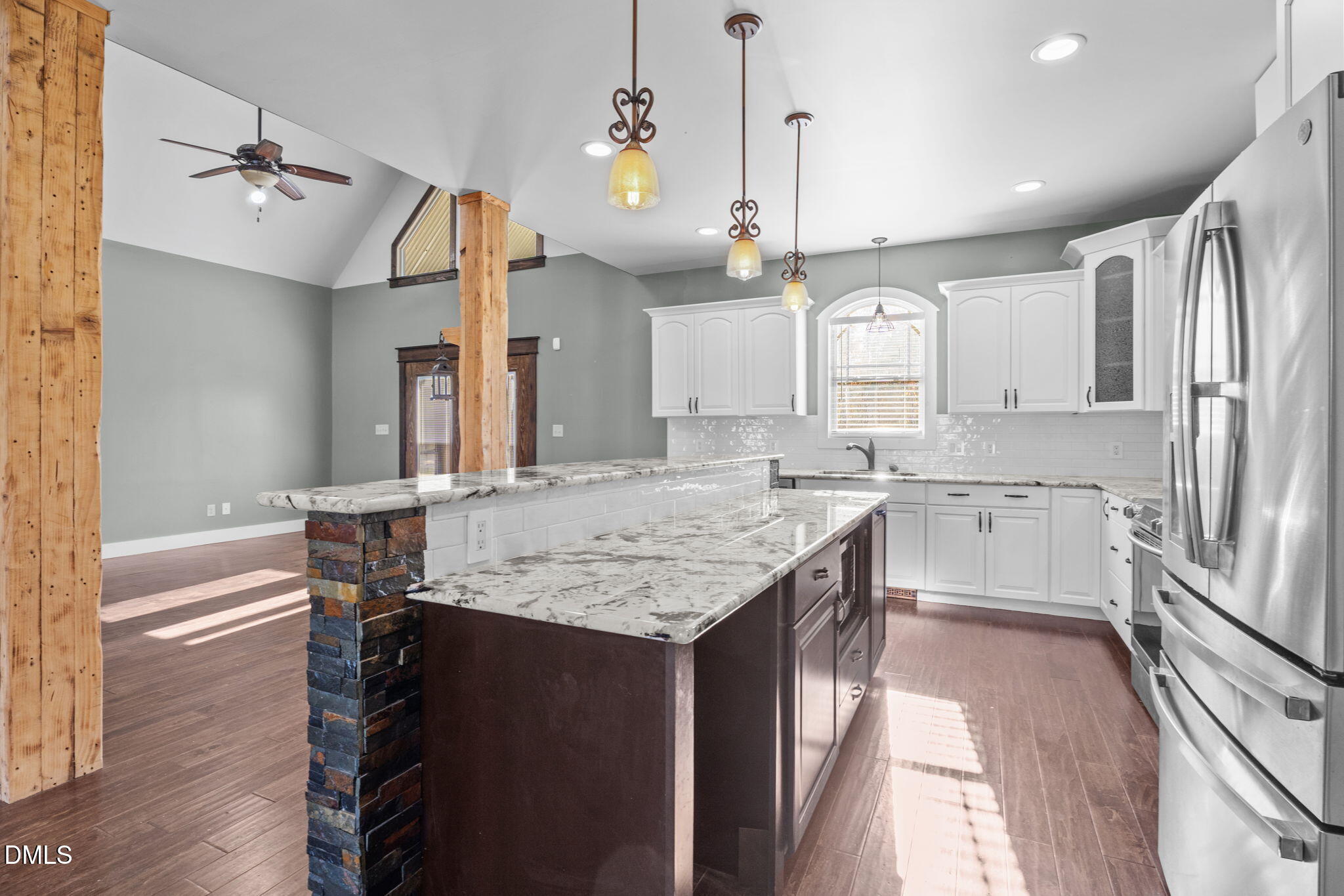 6559 Dolphus Lane Sims, NC 27880 - Photo 8 of 43 a kitchen with granite countertop kitchen island stainless steel appliances a sink cabinets and wooden floor