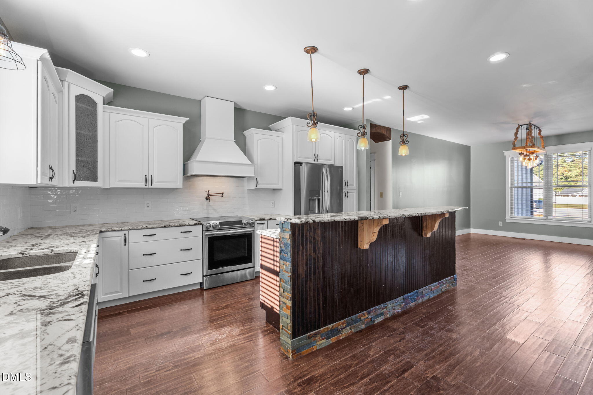 6559 Dolphus Lane Sims, NC 27880 - Photo 9 of 43 a kitchen with stainless steel appliances granite countertop a stove a sink and a refrigerator