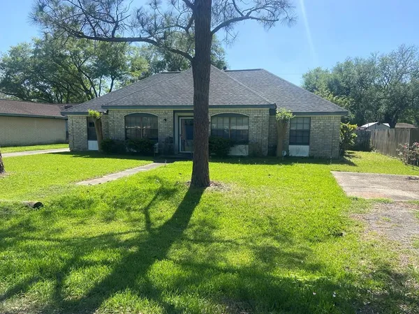 a view of a house with swimming pool and a yard