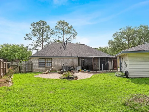a front view of house with yard and outdoor seating