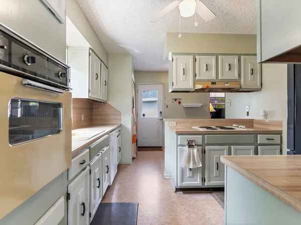 a kitchen with a sink and cabinets