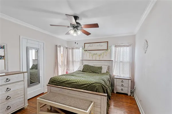 a bedroom with a large bed and a window