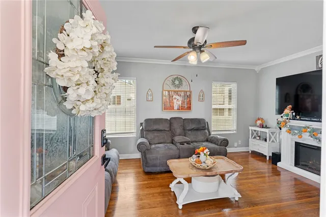 a living room with furniture and a flat screen tv