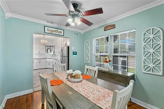 a view of a dining room with furniture window and wooden floor