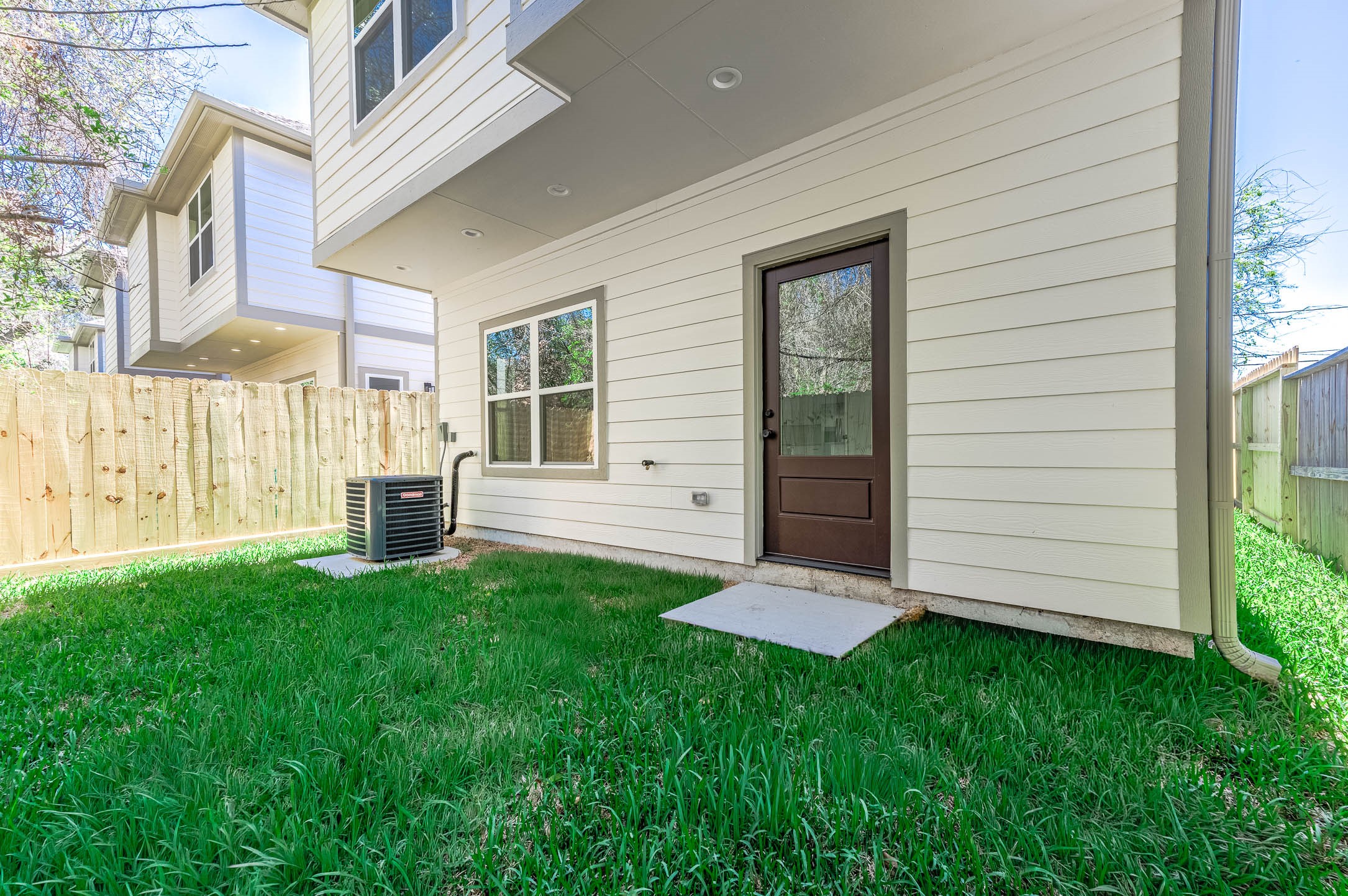 2024 Hampton Street, Unit A B Houston, TX 77088 - Photo 28 of 31 Unit B's own fenced yard for outdoor space and privacy. (Image edited to show expected spring grass growth.)