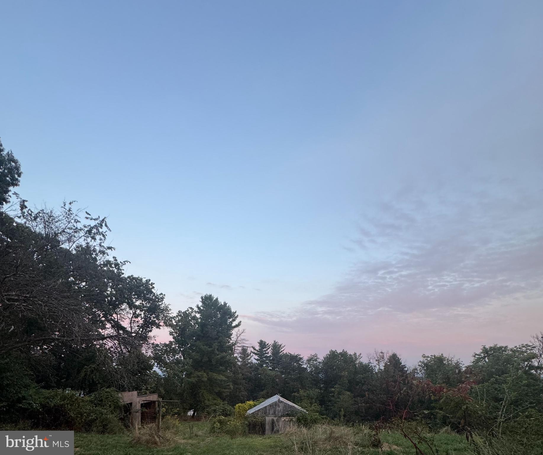 7023 Edgemont Road Frederick, MD 21702 - Photo 1 of 3 a view of a city with lush green forest