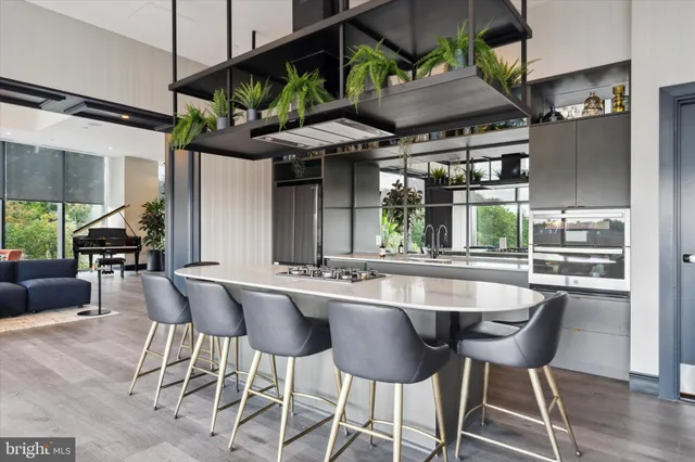 a dining area with a table and chairs