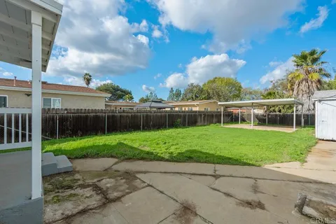 a view of backyard with a small cabin