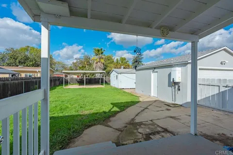 a view of a porch with a yard