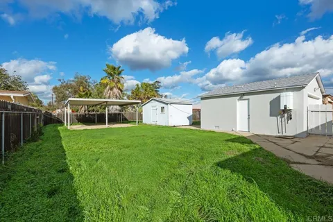 a view of a backyard with a garden