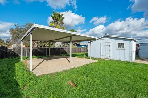 a house with yard in front of it