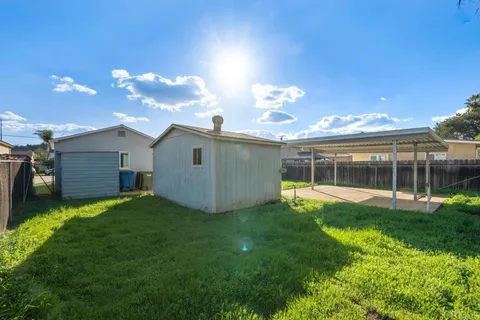 an aerial view of residential building with green space
