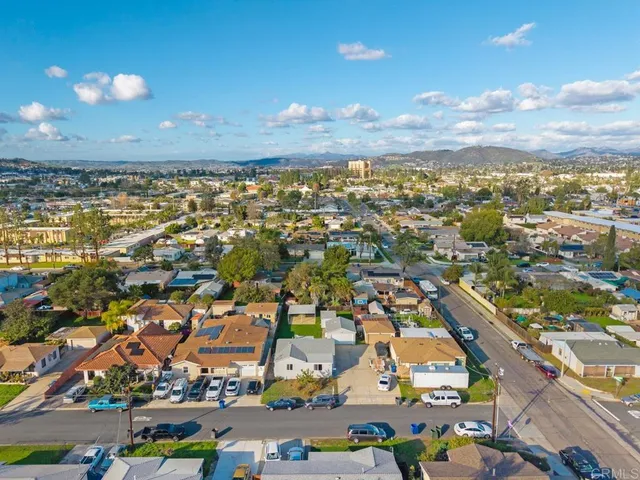 an aerial view of residential building with green space