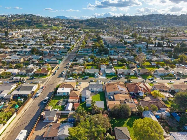 an aerial view of residential houses with outdoor space