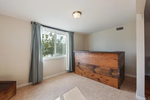 a living room with couches and view of living room