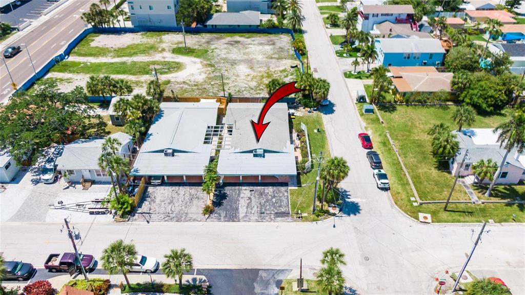 50 154th Avenue, Unit 50 Madeira Beach, FL 33708 - Photo 2 of 2 an aerial view of a house with a swimming pool