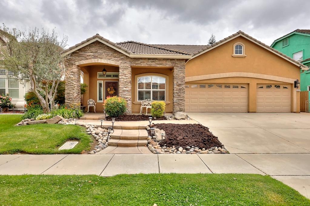 4152 Post Oak Drive Turlock, CA 95382 - Photo 1 of 71 a front view of a house with a yard