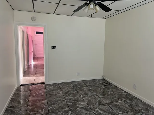 a view of an empty room and window