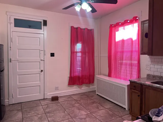 a kitchen with stainless steel appliances a stove a sink and a refrigerator