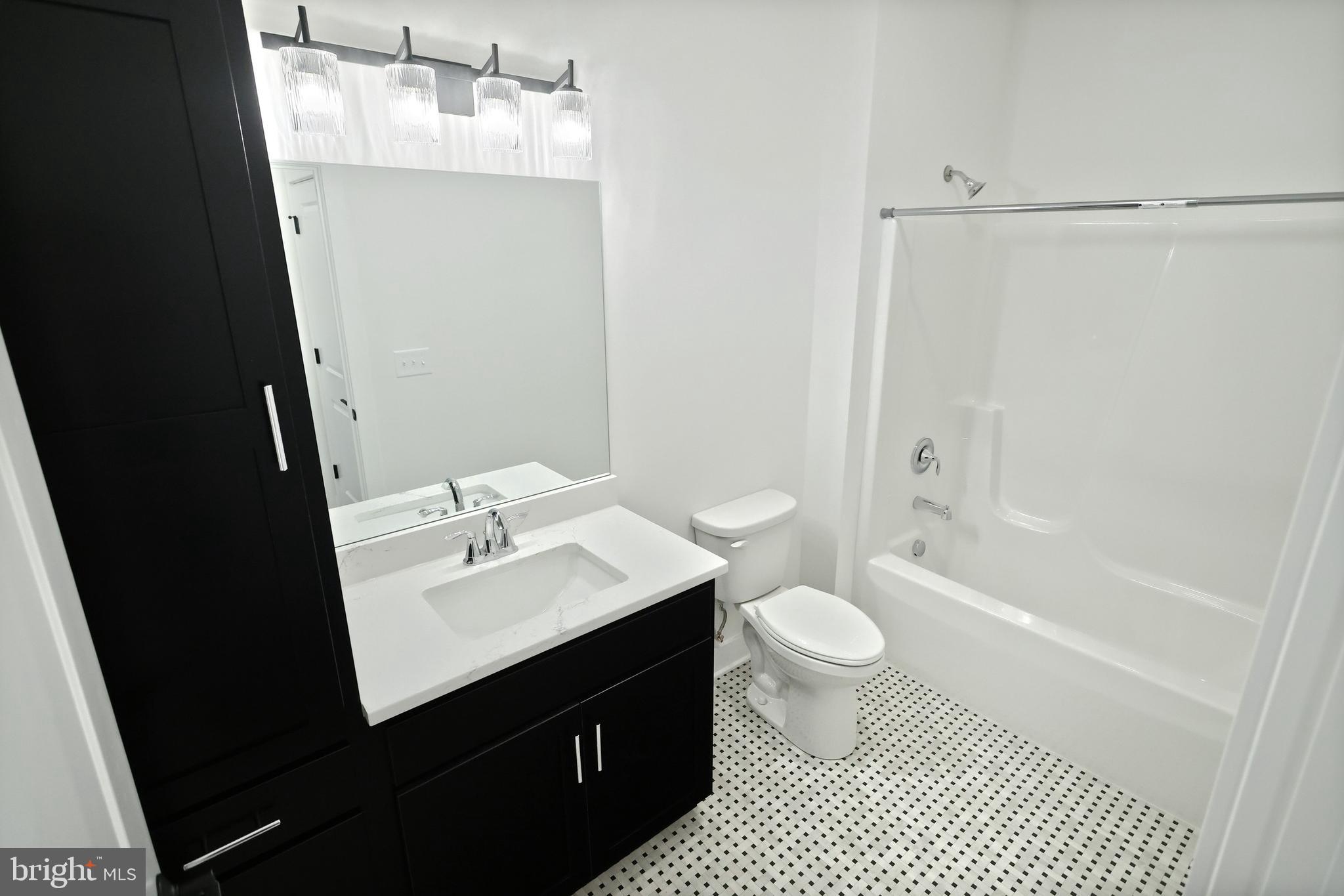 559 Lumber Street Littlestown, PA 17340 - Photo 14 of 73 a bathroom with a sink a toilet a mirror and shower