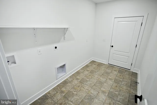a kitchen with granite countertop a sink stainless steel appliances and cabinets